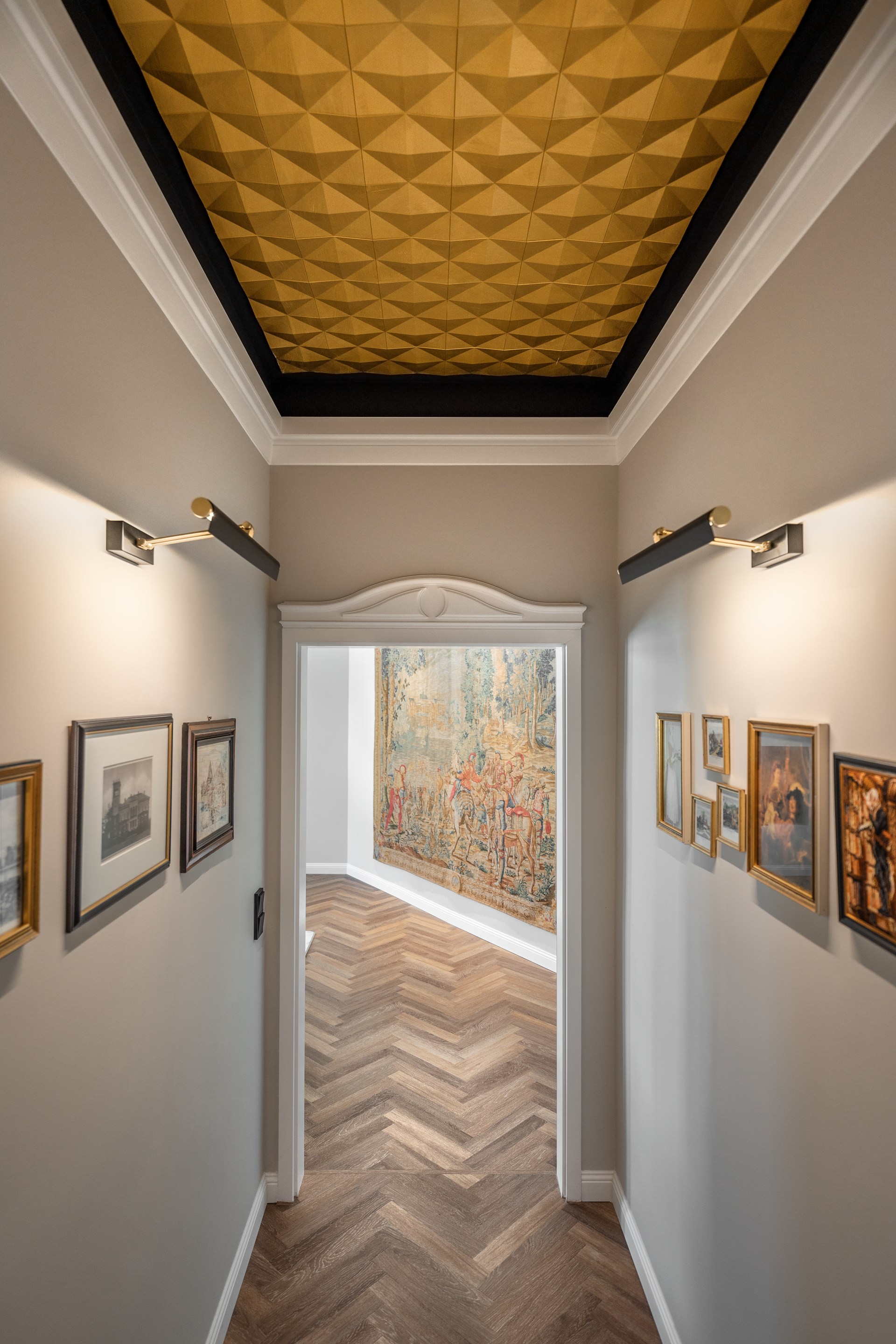 Geometric wall panels applied to the ceiling, creating a sculptural ceiling feature with strong architectural depth.